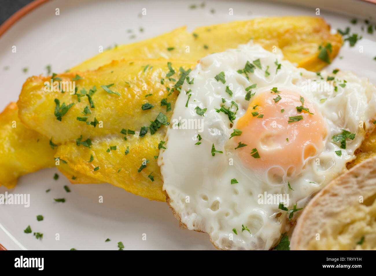 Smoked, farmed Basa fillets, Pangasius Hypophthalmus, imported from Vietnam and bought in the UK from a Lidl store. Basa, also known as river cobbler, Stock Photo