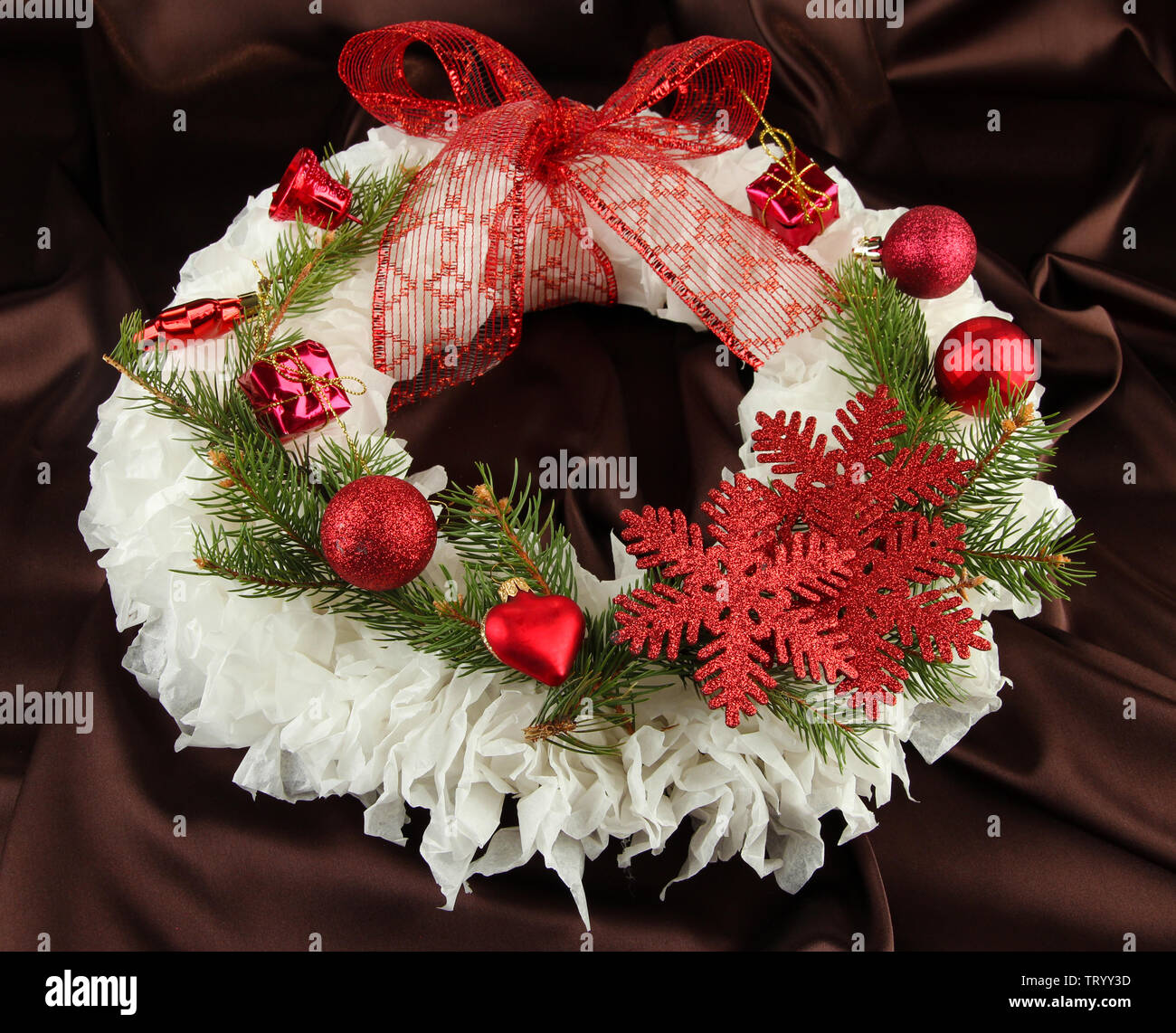 Christmas wreath on fabric background Stock Photo