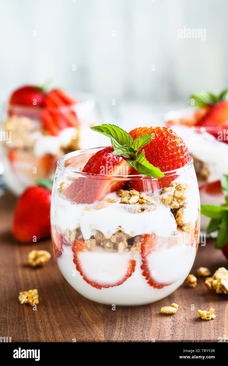 Healthy breakfast of strawberry parfaits made with fresh fruit, yogurt