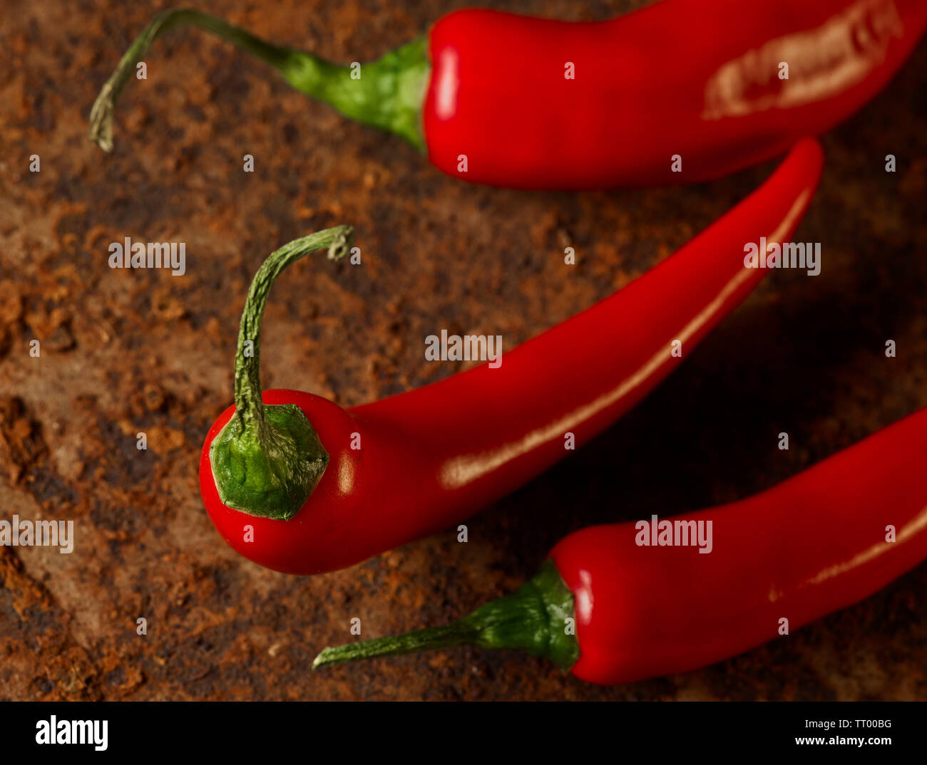 red chillie peppers on a rusty background Stock Photo