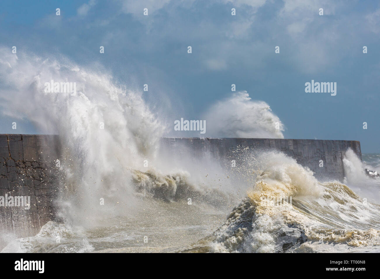 Rough seas crashing over the breakwater at Newhaven Harbour during Storm Miguel on 8th June 2019 Stock Photo