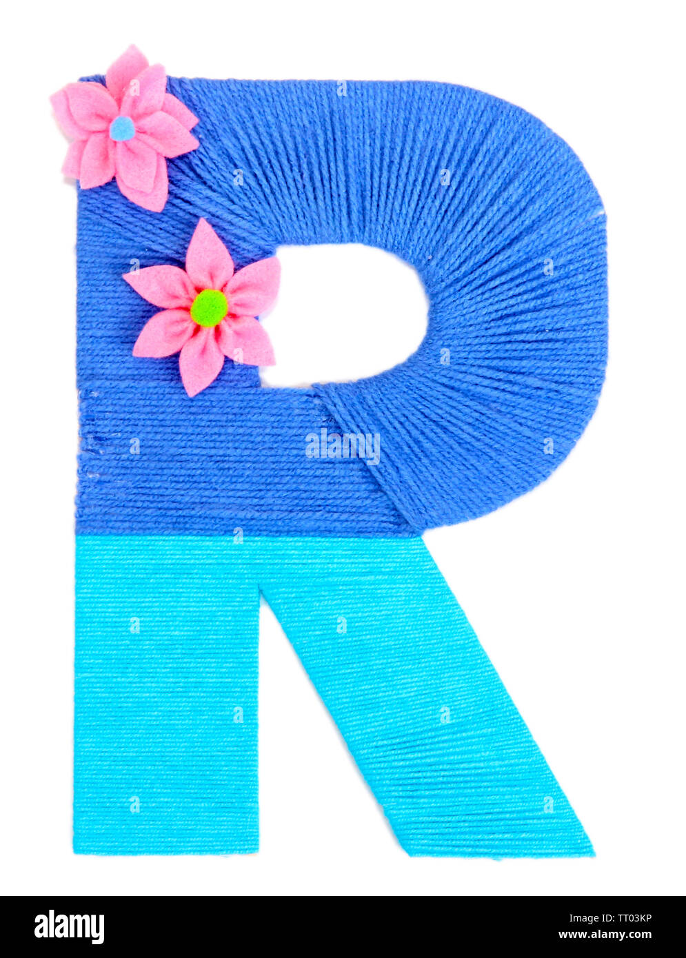 Letter R created with brightly colored knitting yard isolated on white ...