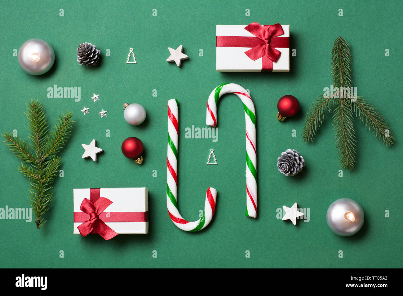 Green, white and red christmas composition with candy canes and gift ...