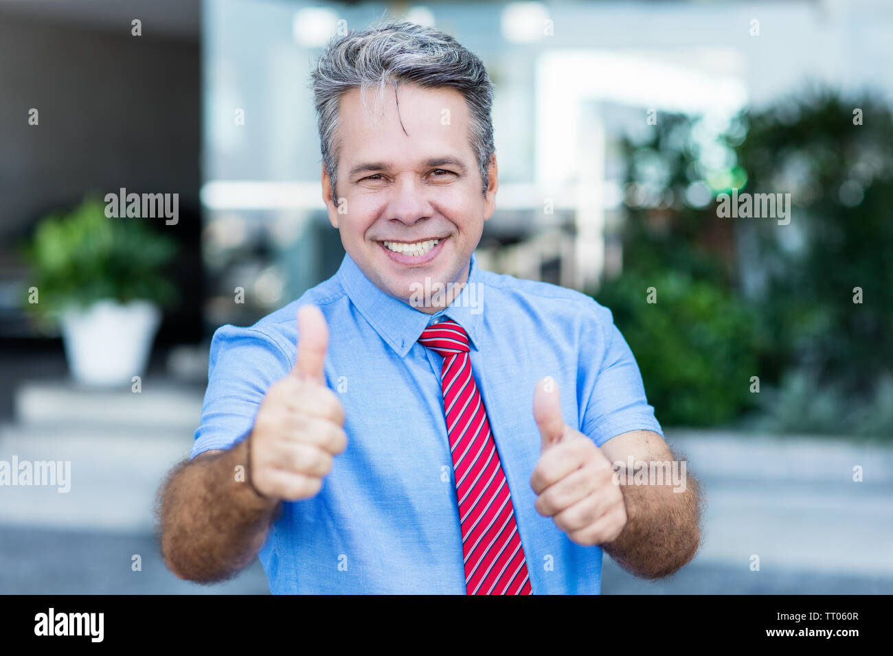 Mature male entrepreneur showing hi-res stock photography and images - Alamy