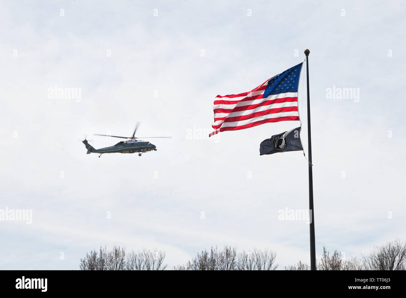 Marine One flying over the Tidal Basin in Washington D.C. with the U.S. and P.O.W. M.I.A flags. Stock Photo