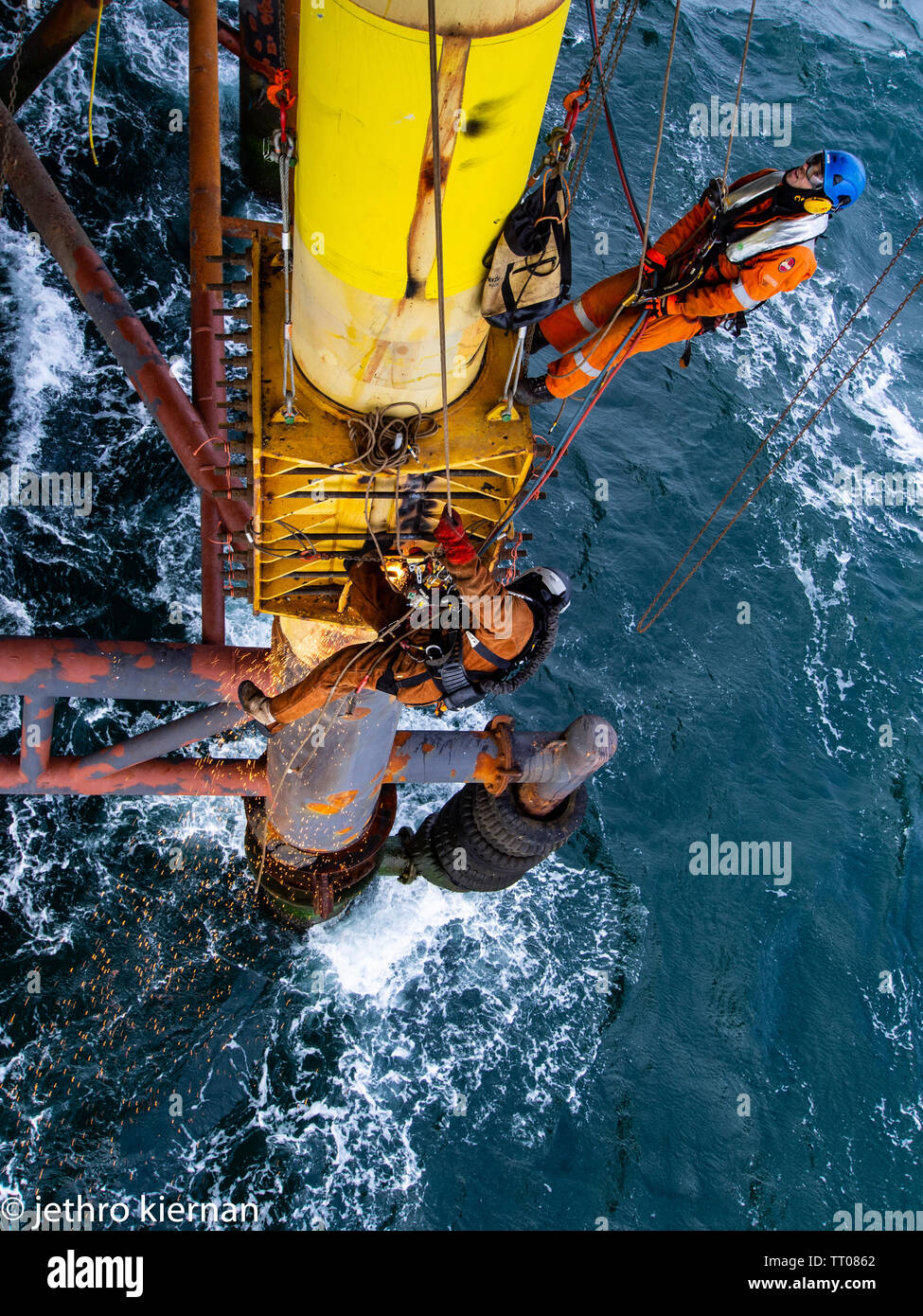 Rope access decomisining of oil and gas platform Stock Photo
