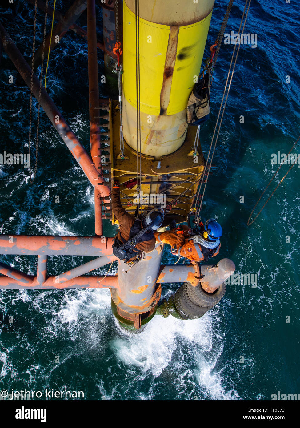 Rope access decomisining of oil and gas platform Stock Photo