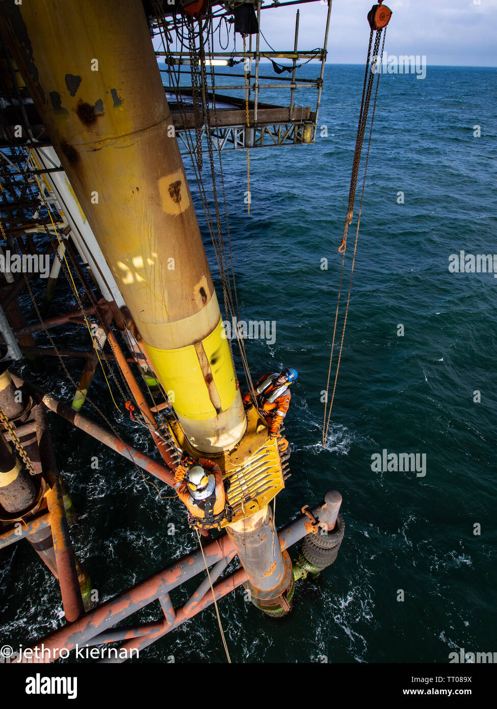 Rope access decomisining of oil and gas platform Stock Photo