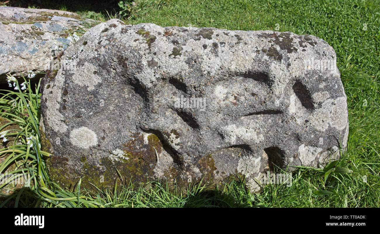 Cup-and-Ring marked stone at the entrance to the Tregiffian Burial Chamber, a Neolithic or early Bronze age chambered tomb, near Lamorna, Cornwall, En Stock Photo