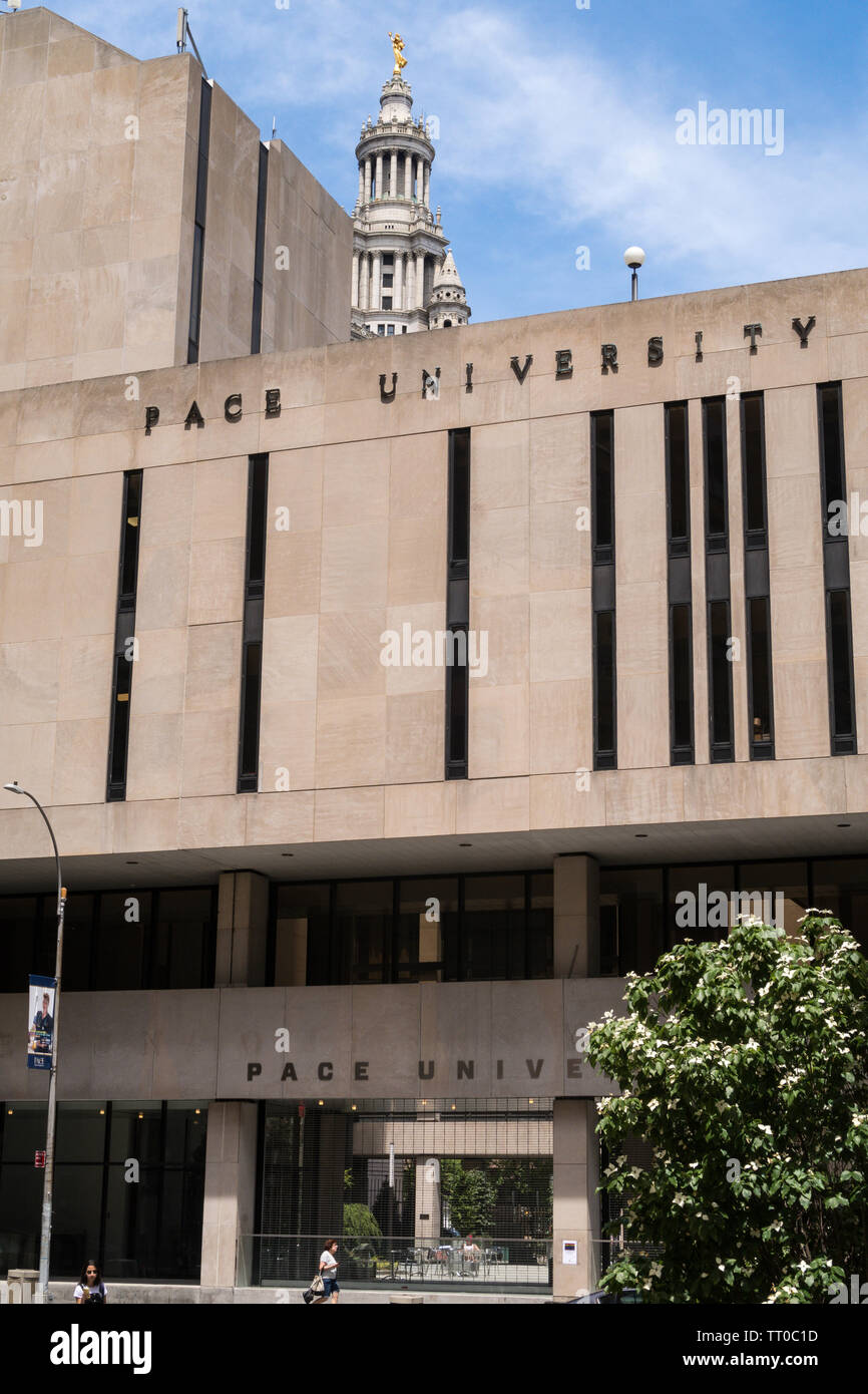 Pace University campus in Lower Manhattan with the Municipal Building towering in background, NYC, USA Stock Photo
