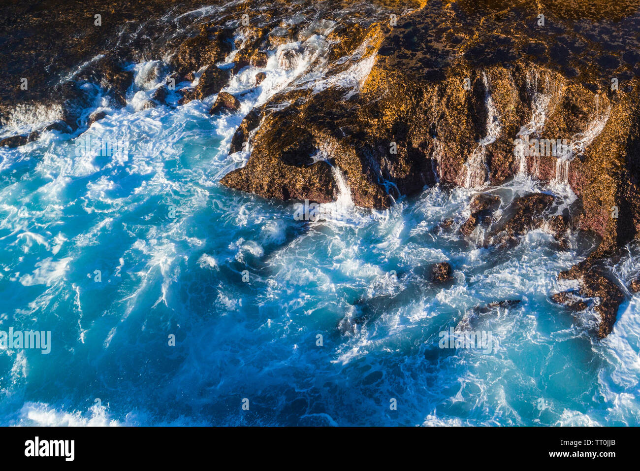 Aerial view of the Indian Ocean breaking onto a reef, Northwest Australia. Stock Photo