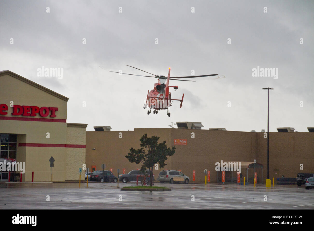 Coast Guard Helicopter landing in parking lot during rescue efforts in ...