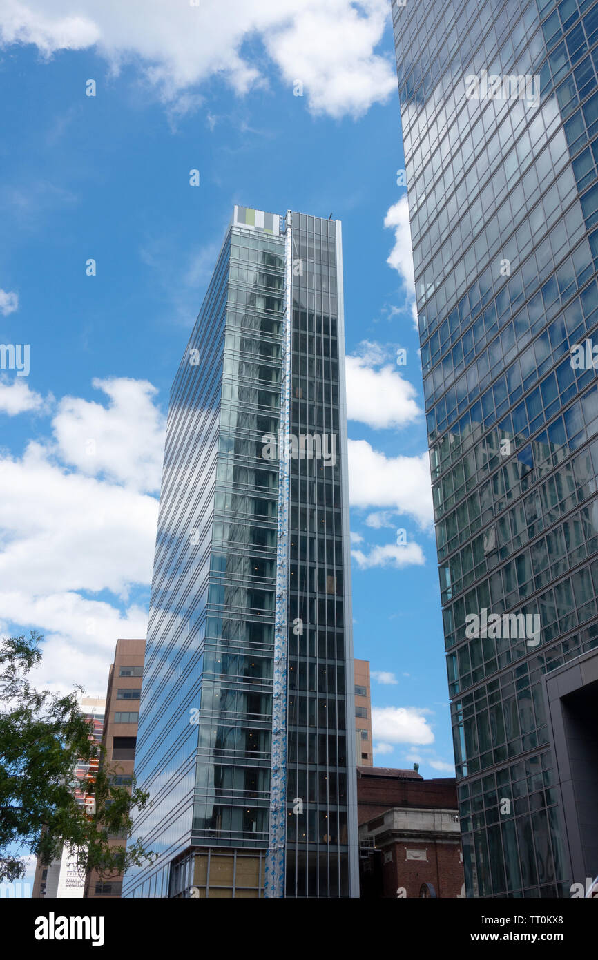 Tall glass skyscraper building under construction in downtown Boston, Massachusetts USA Stock Photo