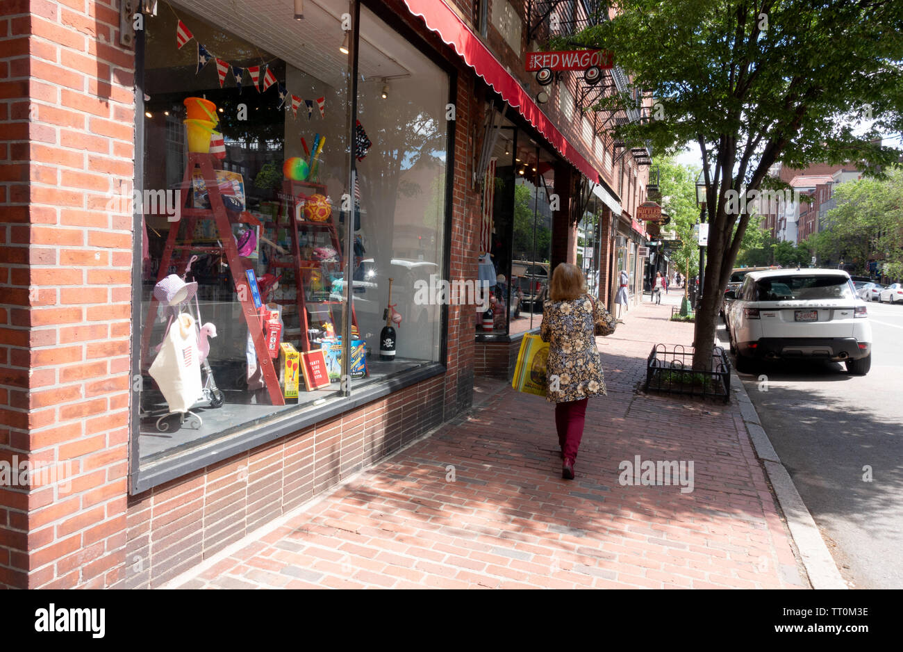 Charles Street Beacon Hill brick storefronts and sidewalks in Boston, Massachusetts Stock Photo