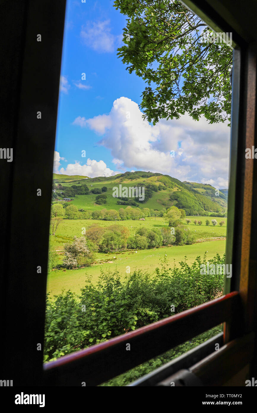 A view from out of the carriage window on the Talyllyn Railway which runs from Tywyn to Nant Gwernol, Gwynedd, Wales, UK Stock Photo