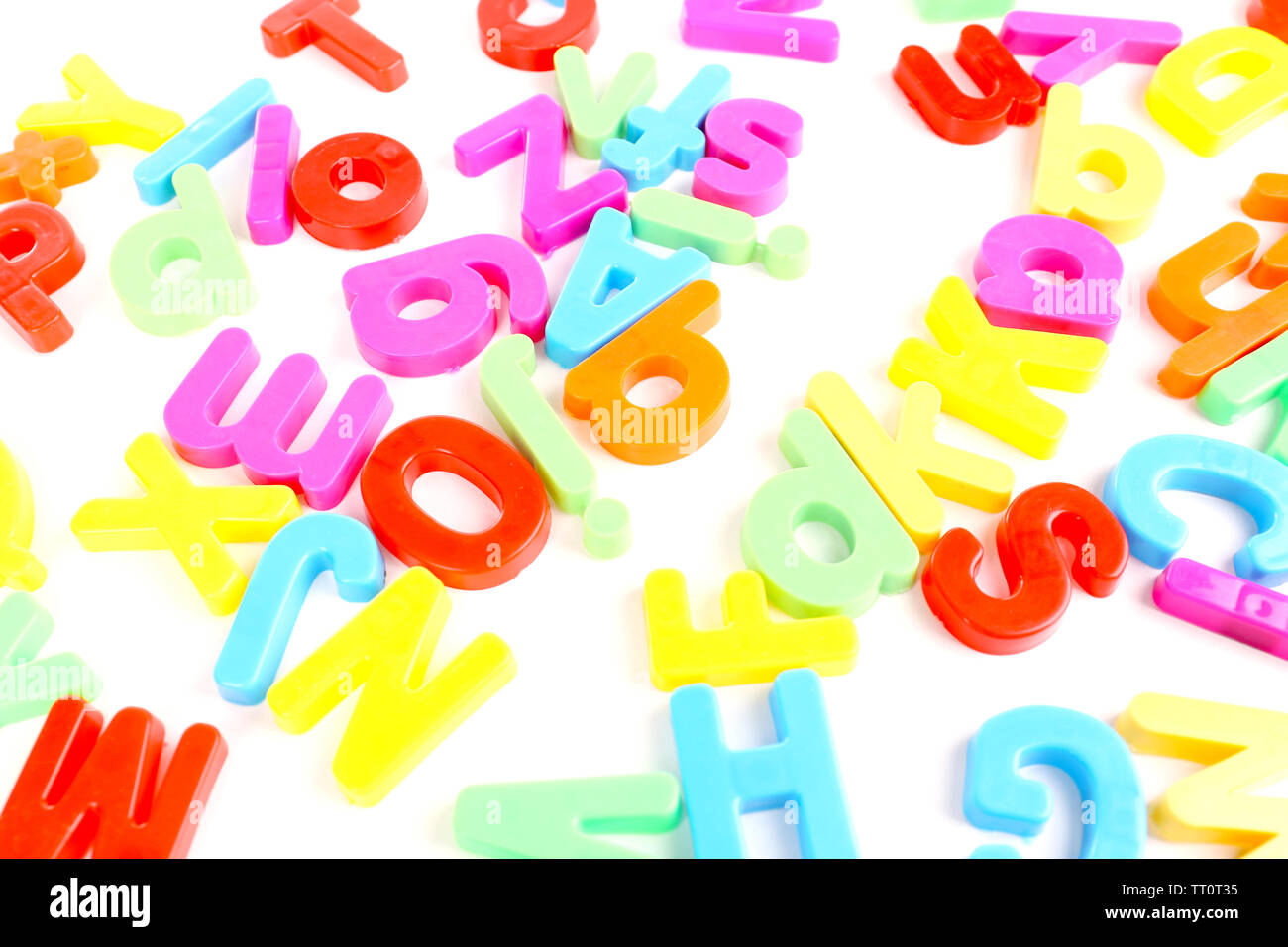 Colorful magnetic letters isolated on white Stock Photo - Alamy