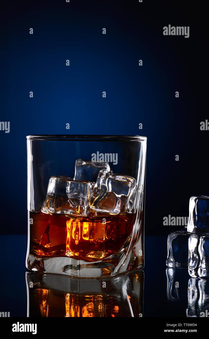 Whiskey With Ice Cubes In Glass Stock Photo, Picture and Royalty Free  Image. Image 12197629.