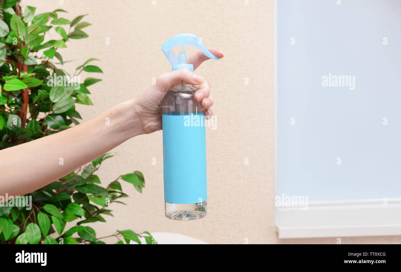 Sprayed air freshener in hand closeup Stock Photo Alamy