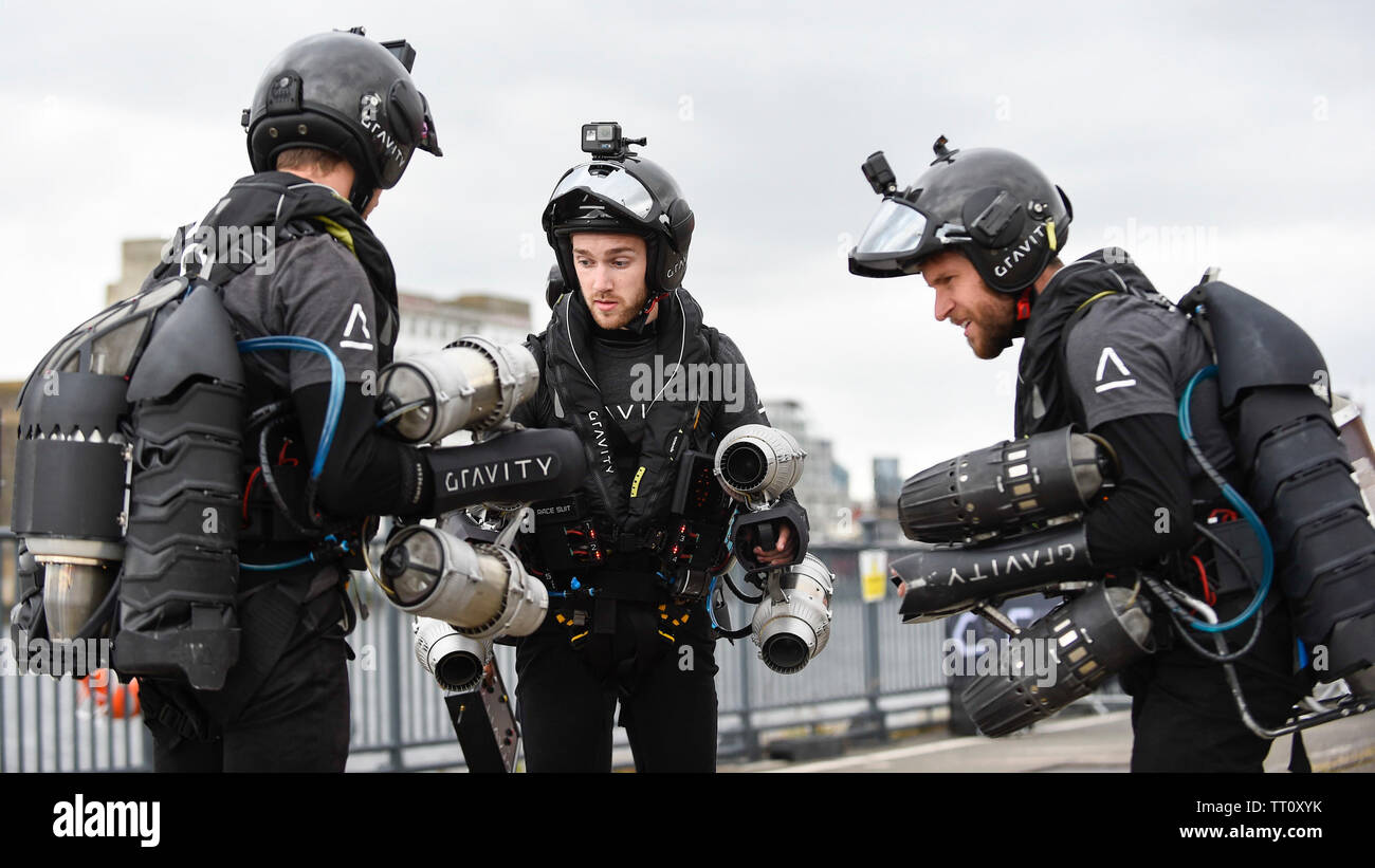 London, UK.  13 June 2019. (L to R) Alex Wilson, Sam Rogers and Richard Browning the Founder and Chief Test Pilot of Gravity Industries and ‘real life Iron Man’ from Gravity Industries prepare to preview their Race Series concept at Royal Victoria Docks, East London, during London Tech Week 2019, ahead of the launch of Gravity Industries’ International Race Series in early 2020.  Gravity Industries are the designers, builders and pilots of the world’s first patented Jet Suit, pioneering a new era of human flight. Credit: Stephen Chung / Alamy Live News Stock Photo