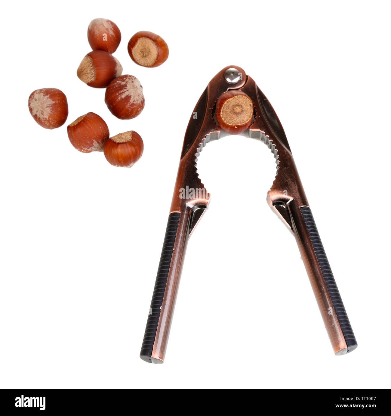 Nutcracker and hazelnuts isolated on white Stock Photo Alamy