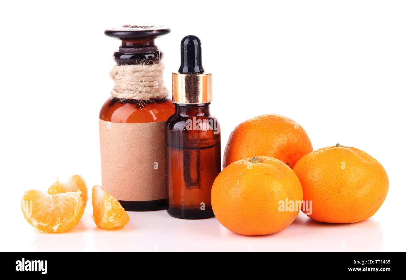 Tangerine essential oil and tangerines, isolated on white Stock Photo