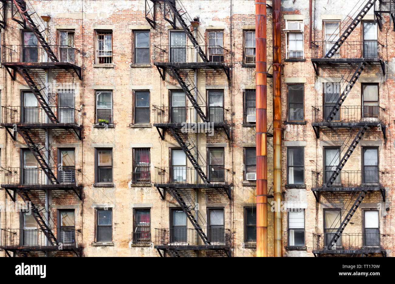New York City old apartment building with rusted metal pipes Stock Photo