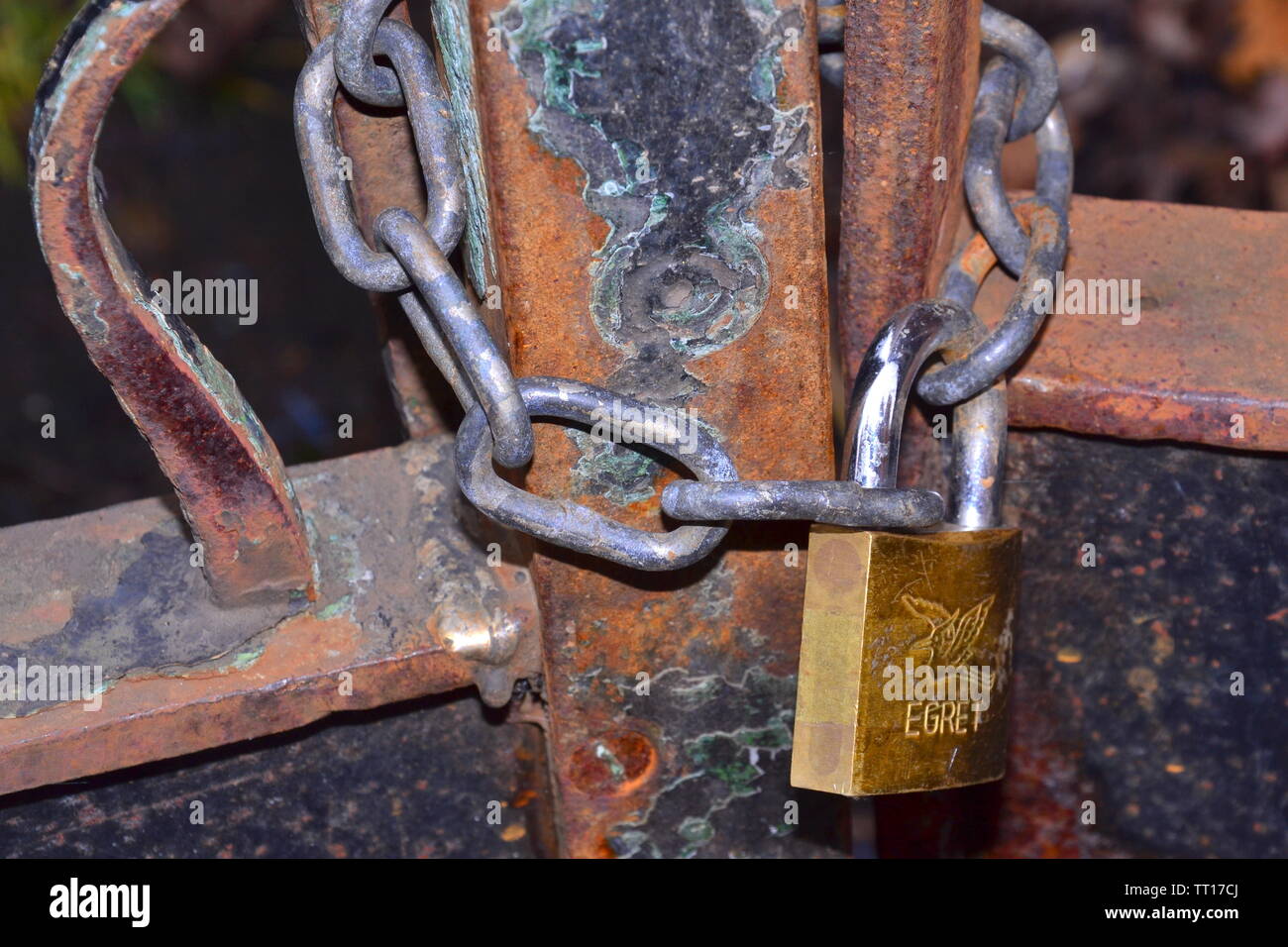 An old metal gate locked with a padlock in Manchester, uk Stock Photo