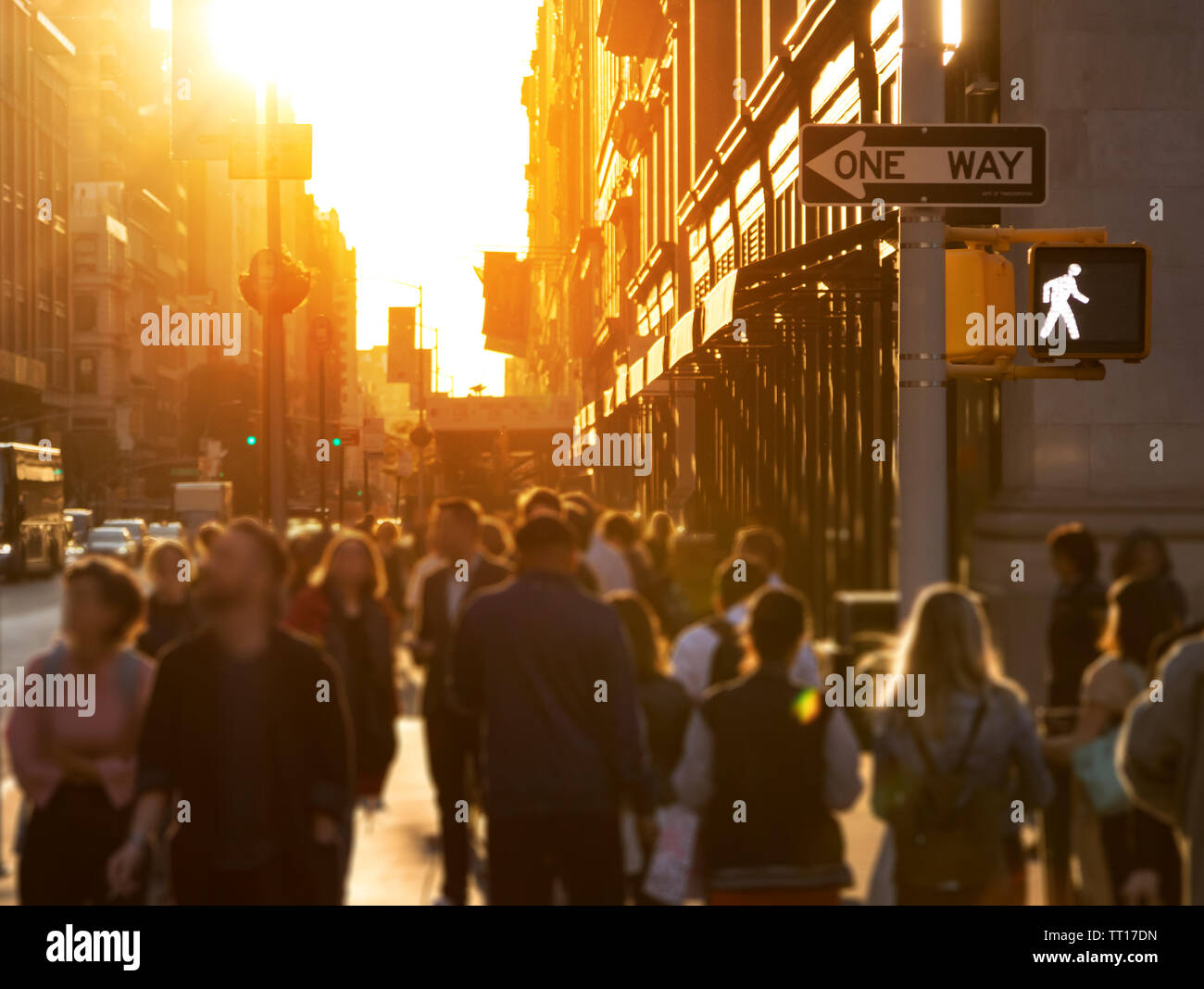 Crowd of anonymous people walking down the busy sidewalk on 23rd Street ...