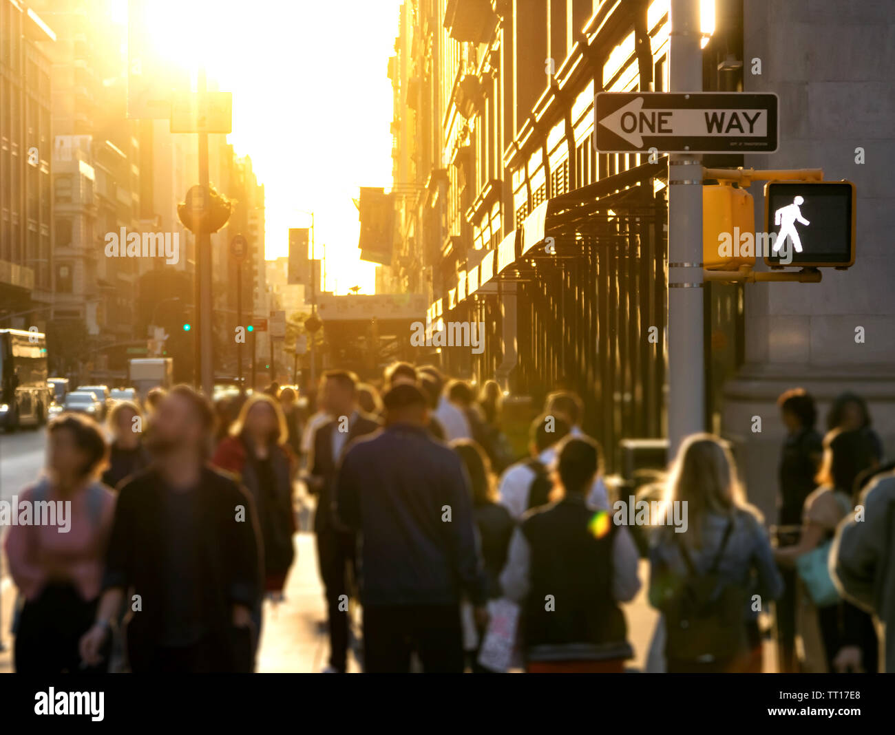 Crowd of anonymous people walking down the busy sidewalk on 23rd Street ...