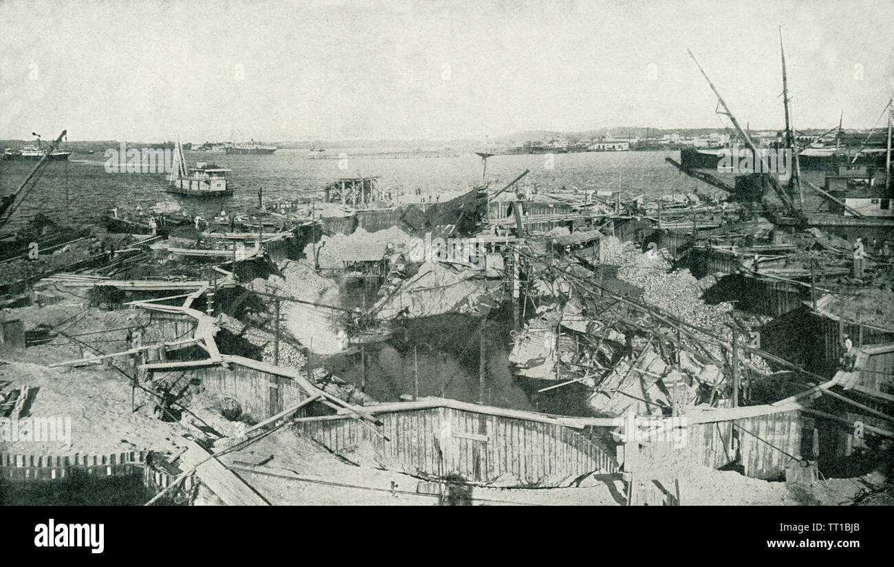 The photo dates to before 1922. The caption reads: A general view of the cause of the Spanish-American War, the cofferdam built to permit a thorough examination, which proved the theory that the disaster was caused by a sunken mine or torpedo. After this inspection, the wreck was cut up, floated out, and sunk in the Gulf of Mexico. Stock Photo
