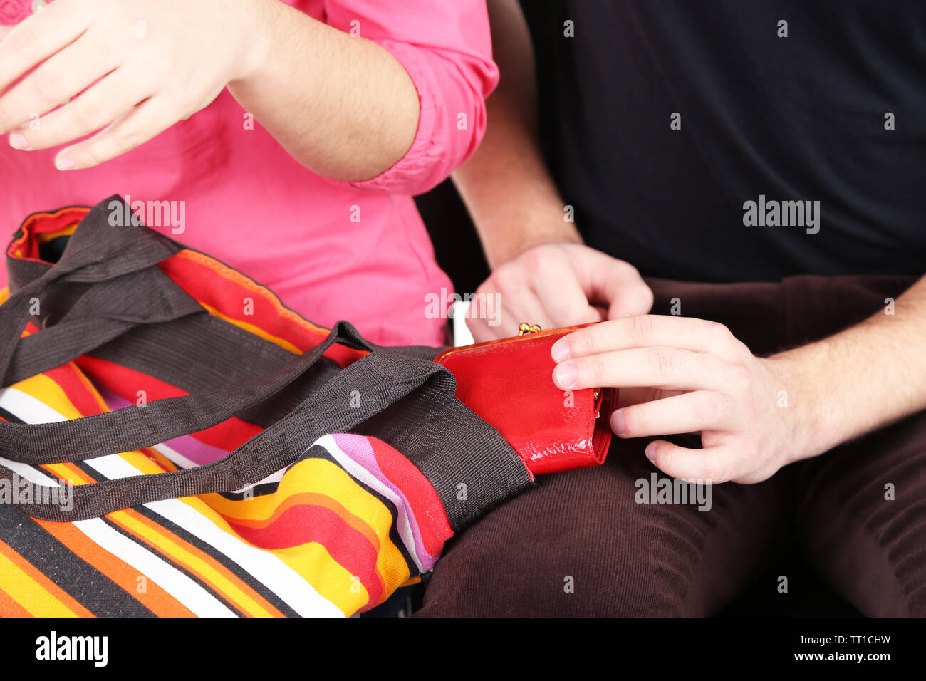 Pickpocket are stealing wallet from bag, close up Stock Photo