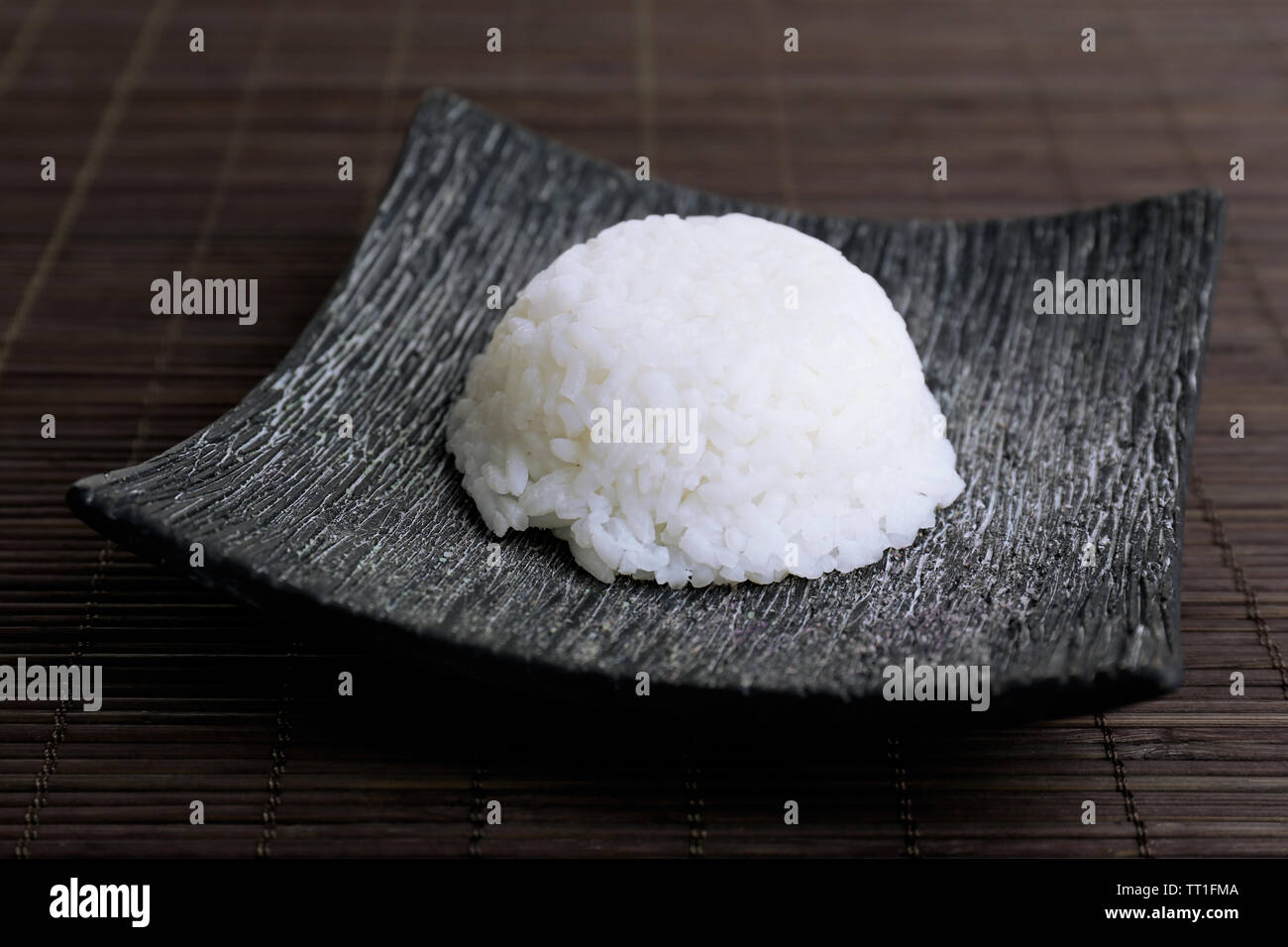 Cooked rice on bamboo background Stock Photo - Alamy