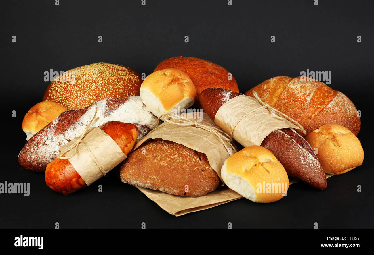 Different types of bread on black background, close-up Stock Photo - Alamy