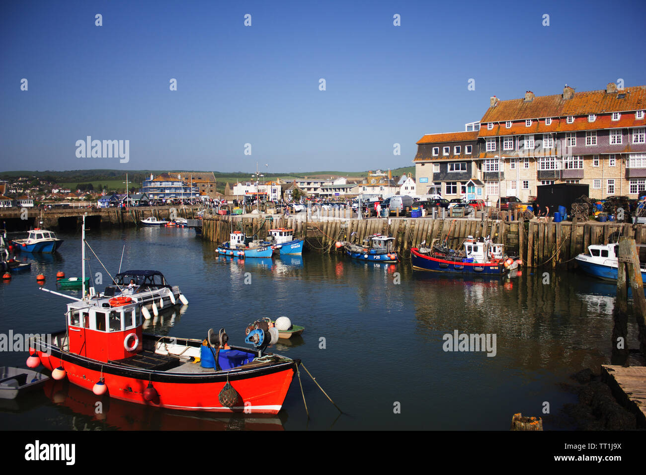 Fishing boats at anchor, West Bay harbour, Dorset Stock Photo - Alamy