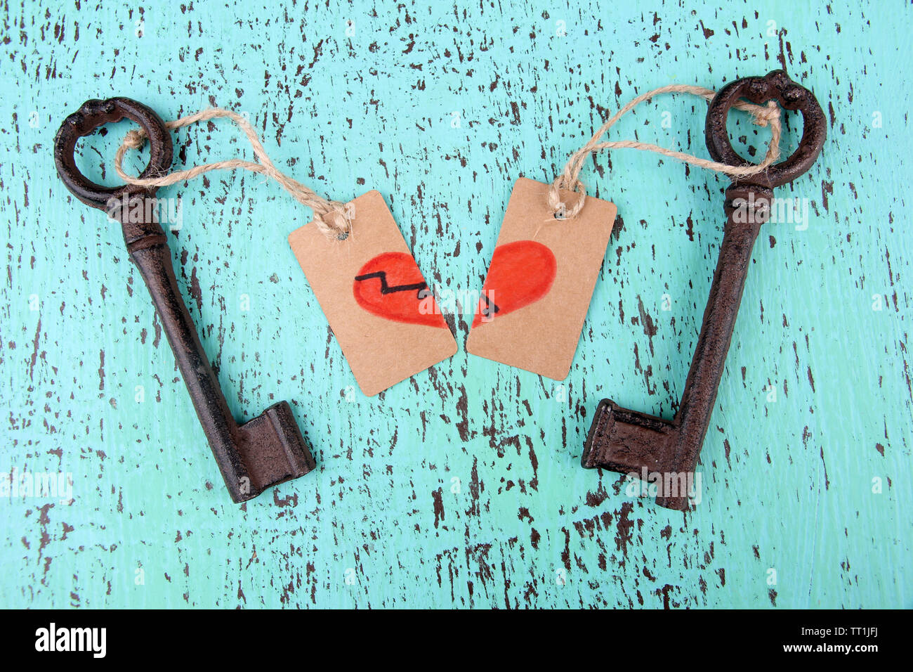 Keys to love, Conceptual photo. On color wooden background Stock Photo