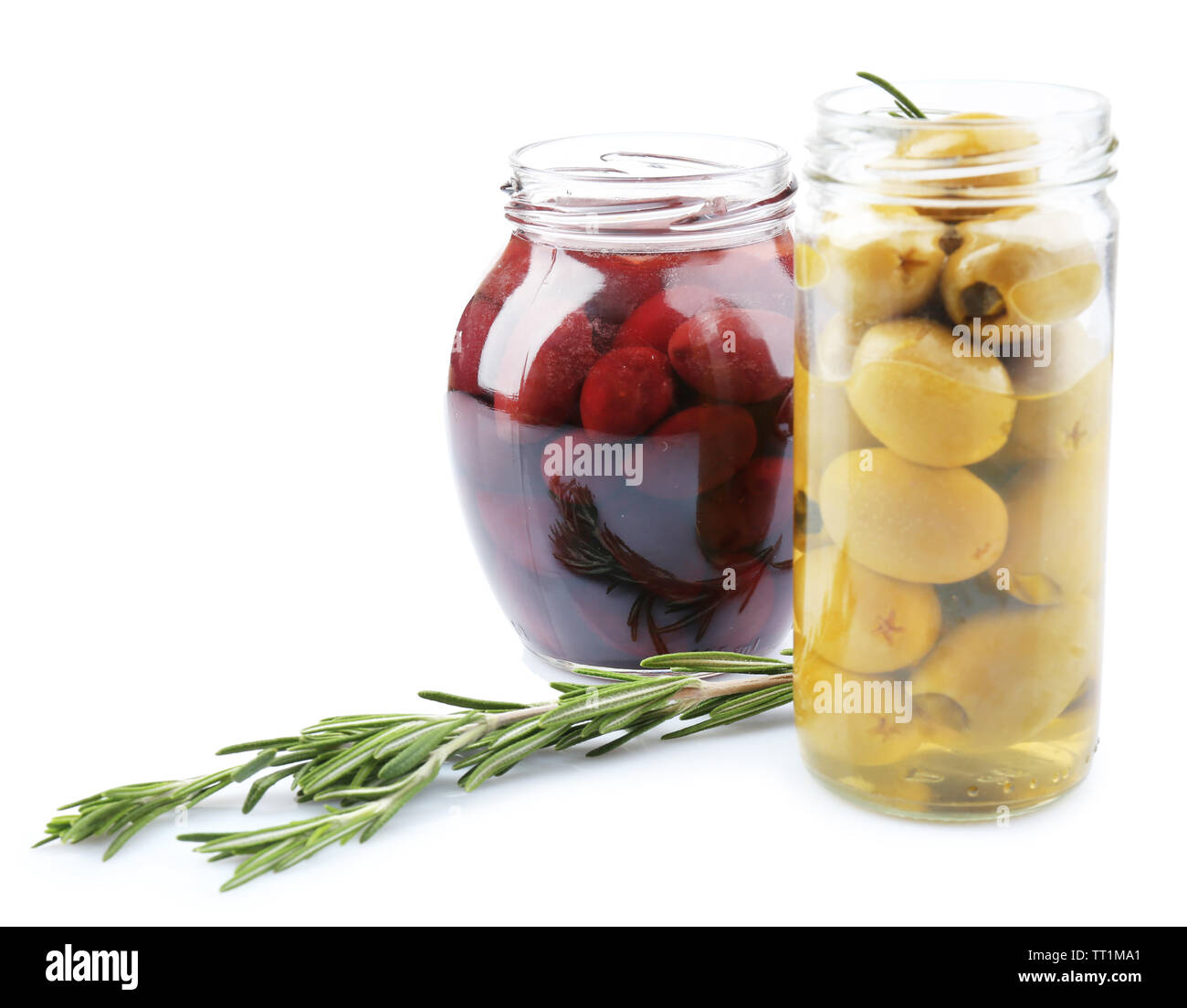 Tasty olives in glass jars, isolated on white Stock Photo Alamy
