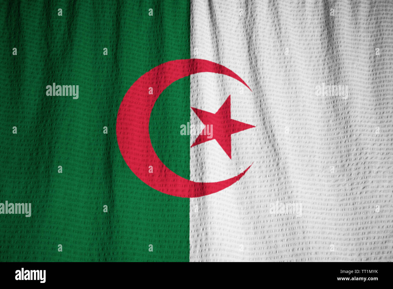 Ruffled Flag of Algeria Blowing in Wind Stock Photo