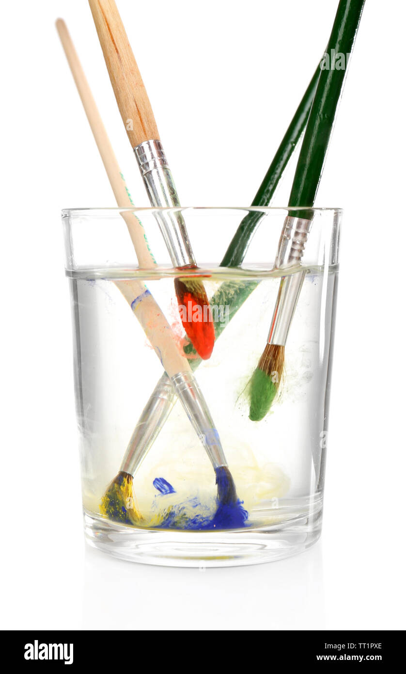 Brush with color paint in glass of water, isolated on white Stock Photo -  Alamy