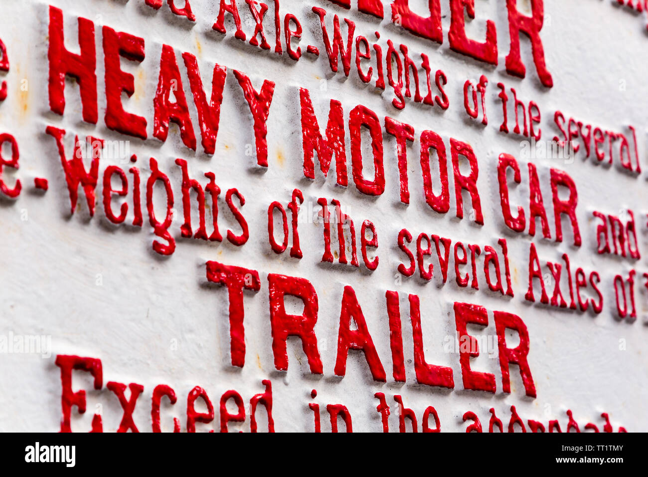 Old red and white metal cast iron Heavy Motor Car and Trailer weight restriction sign for railway level crossing at Didcot Railway Centre, Oxfordshire Stock Photo