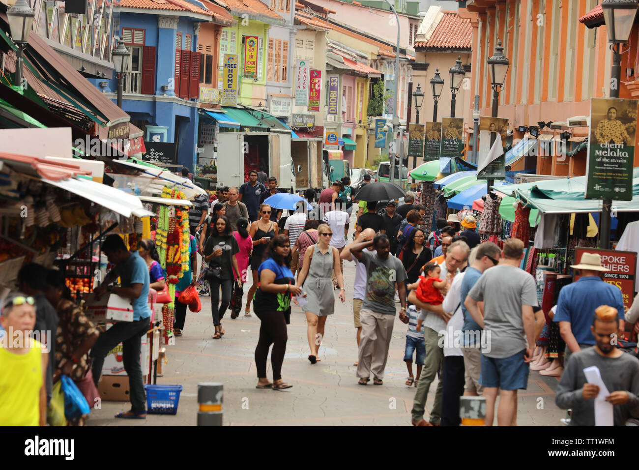 Busy popular shopping street with small shops in the Indian ethnic district of Little India or Tekka of the city state of Singapore. Stock Photo