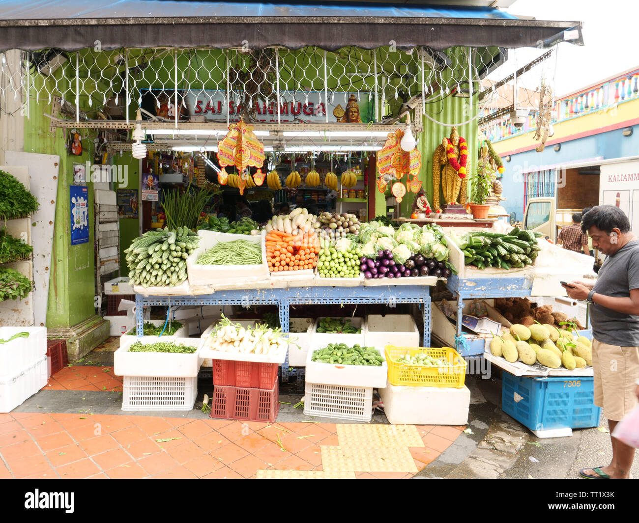 Outside of a shop selling mostly fruits and vegetables in the ethnic district Little India in the city state of Singapore. Stock Photo