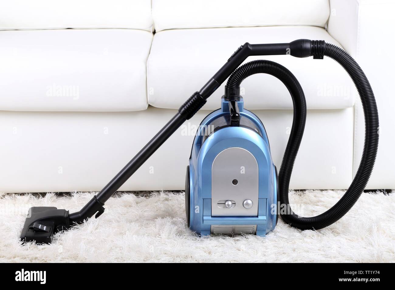 Vacuum cleaner to tidy up the living room Stock Photo Alamy