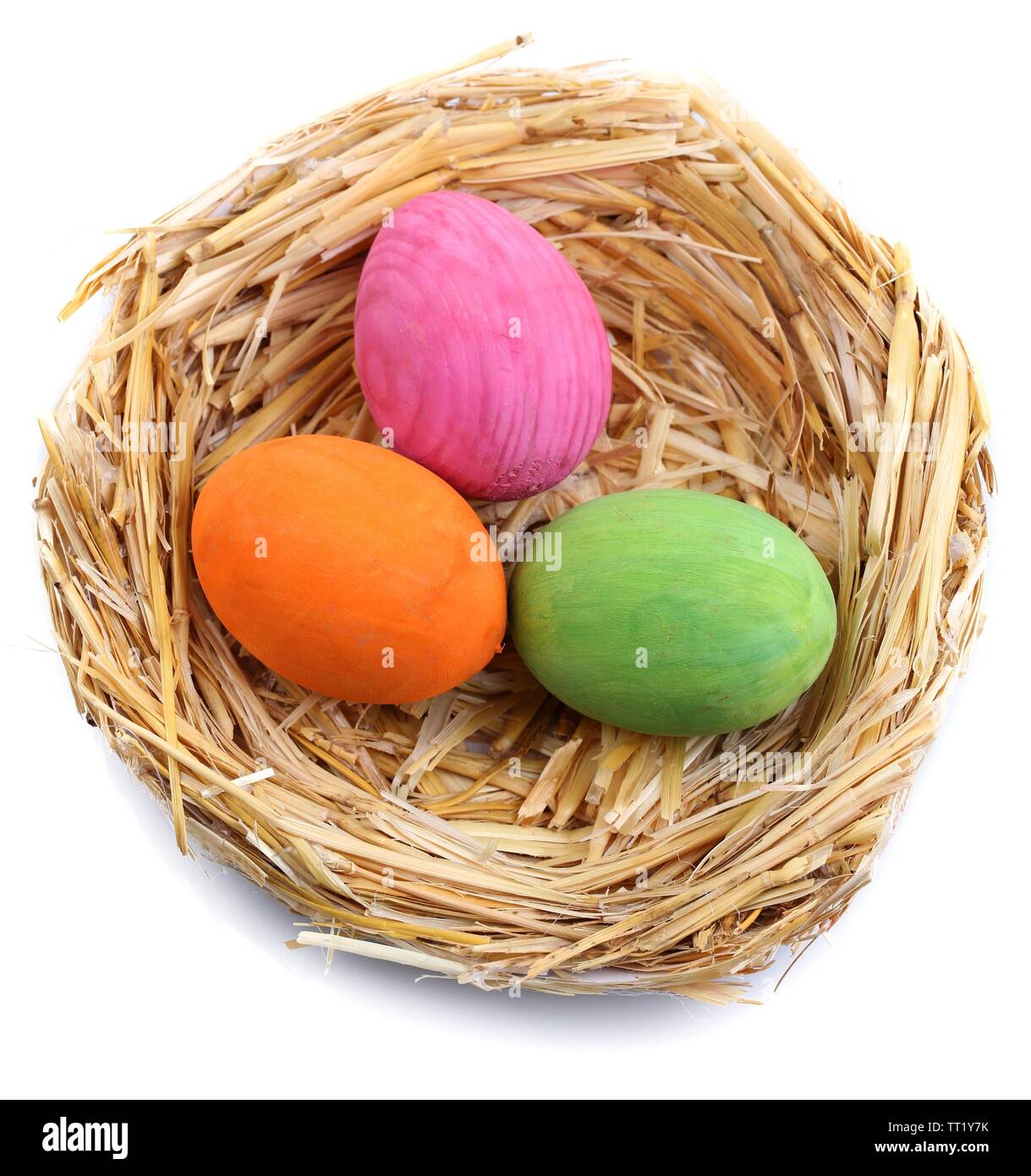 Easter eggs in nest isolated on white Stock Photo - Alamy