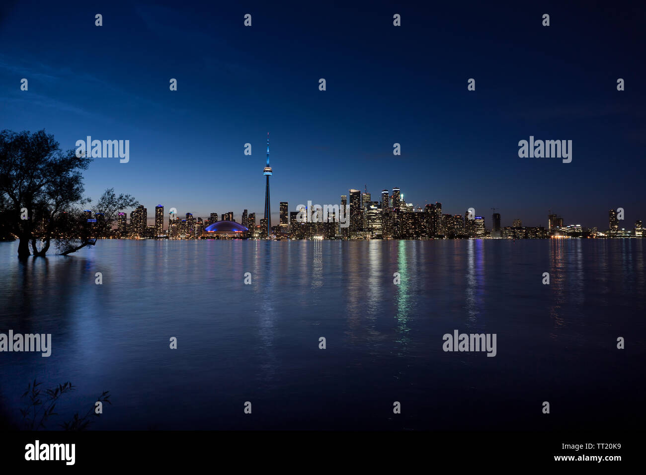 Canada, Toronto, skyline with the CN Tower, view of flooded island in the blue hour, water reflections, June 2019 Stock Photo