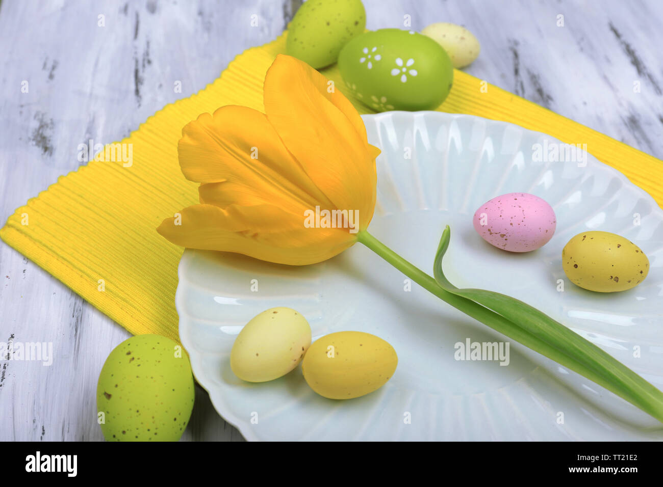 Easter table setting with tulips and eggs Stock Photo - Alamy
