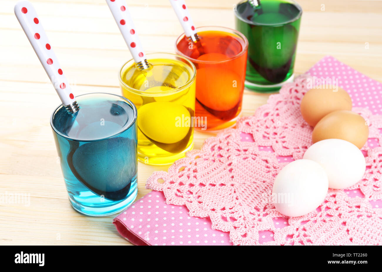 Glasses with paint for Easter eggs and eggs, close up Stock Photo