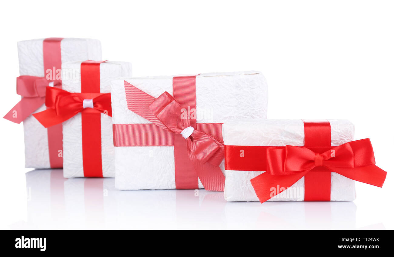 Beautiful gifts with red ribbons, isolated on white Stock Photo - Alamy