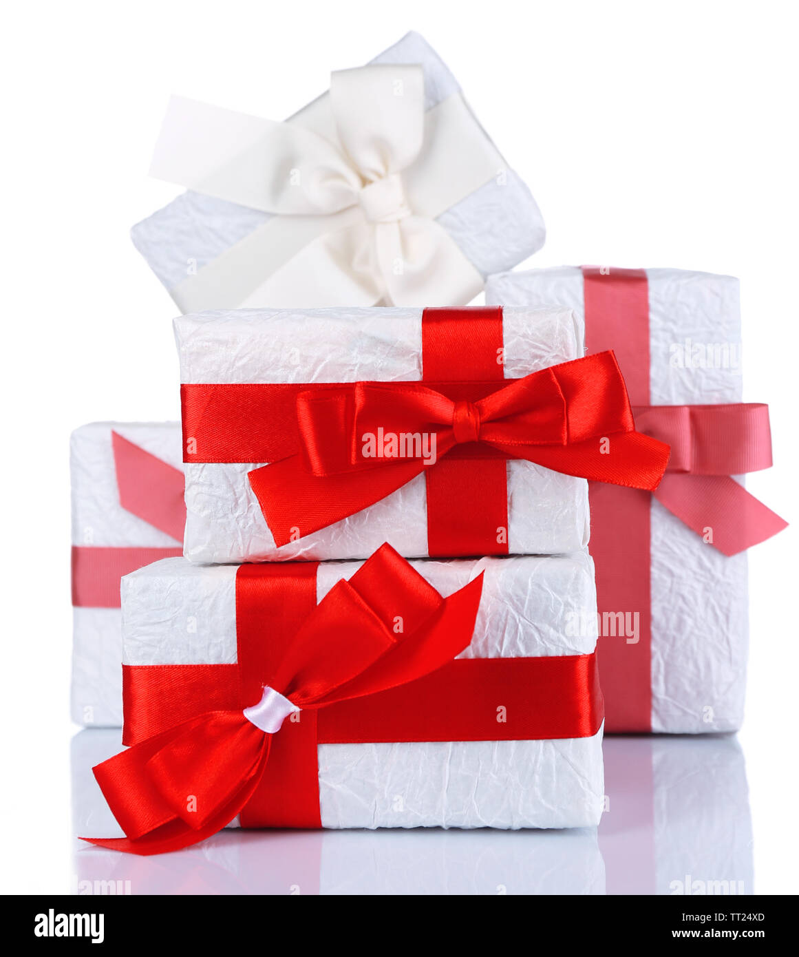 Beautiful gifts with red ribbons, isolated on white Stock Photo - Alamy