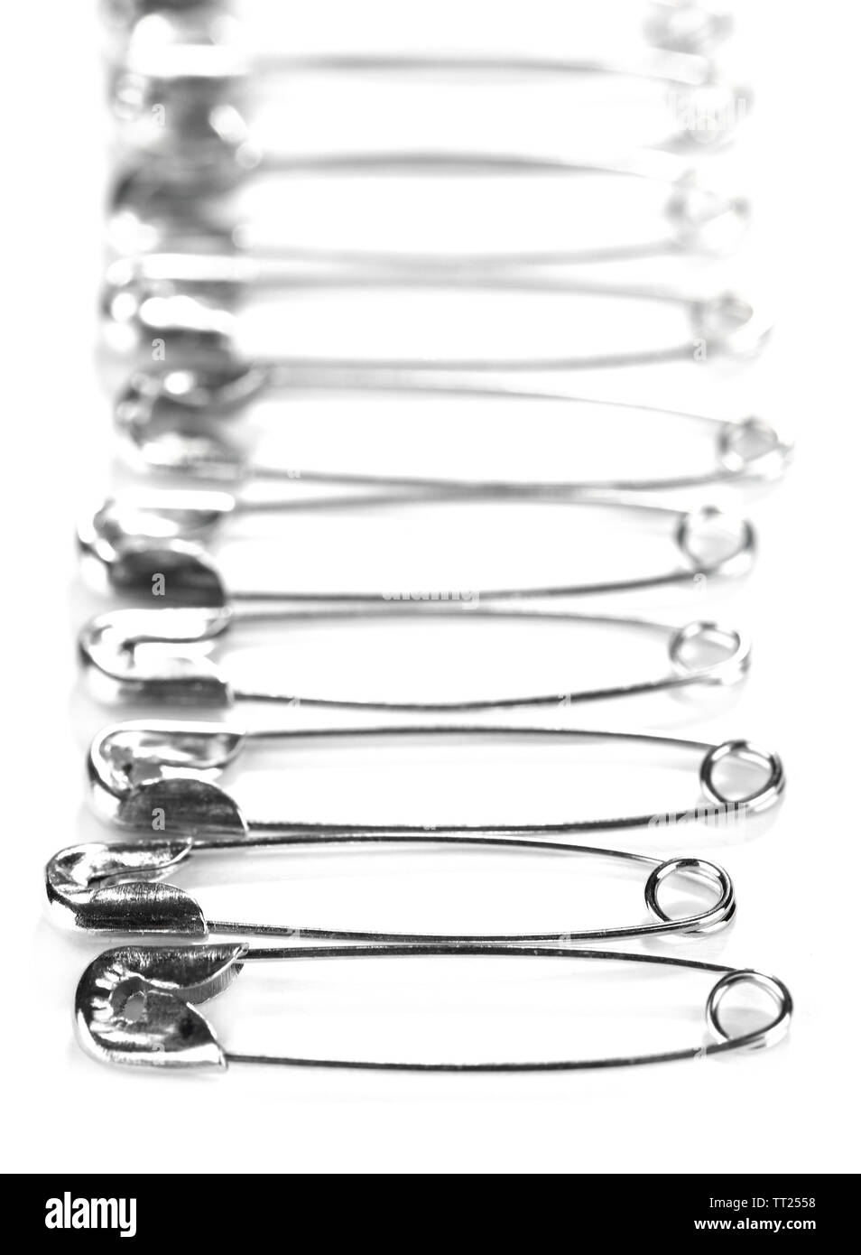Safety pins isolated on white Stock Photo Alamy