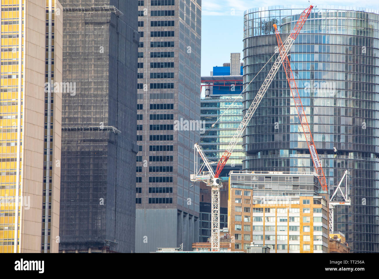 Construction machinery tower cranes in Sydney city centre part of development activity,Sydney,Australia Stock Photo